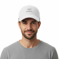 Man wearing white KIND IS THE NEW STRONG cap