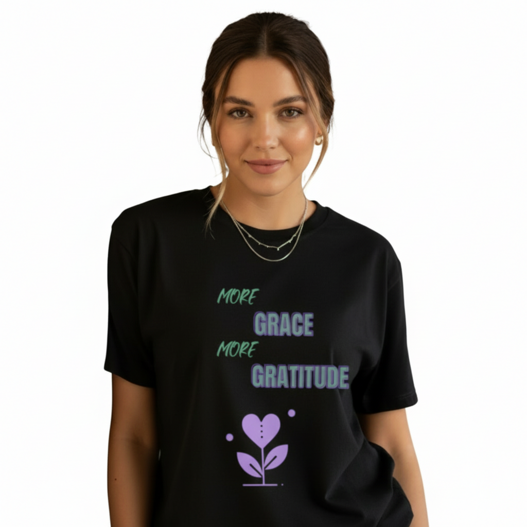 Woman wearing oversized black boyfriend tee with purple More Grace More Gratitude design