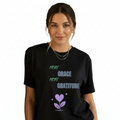 Woman wearing oversized black boyfriend tee with purple More Grace More Gratitude design