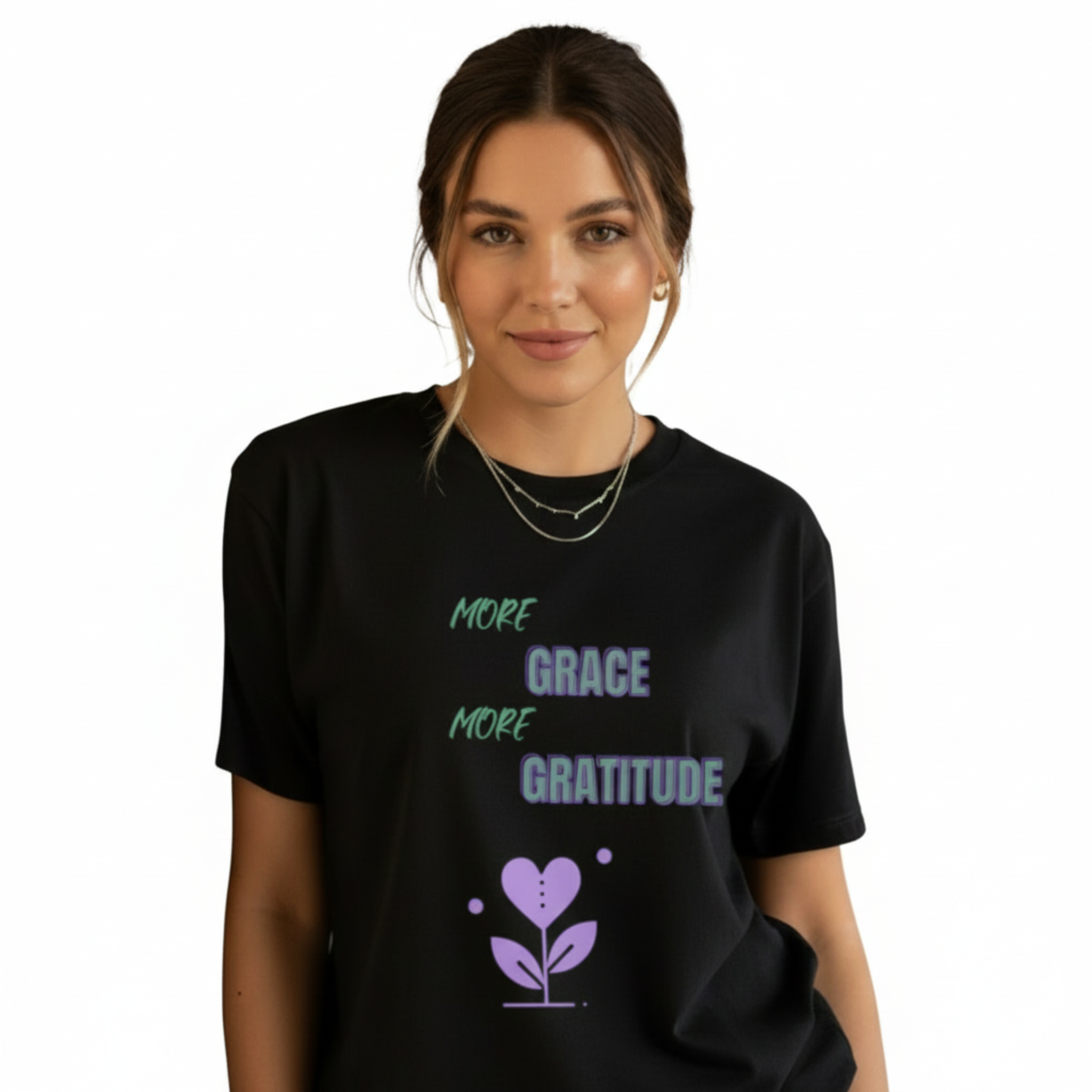 Woman wearing oversized black boyfriend tee with purple More Grace More Gratitude design