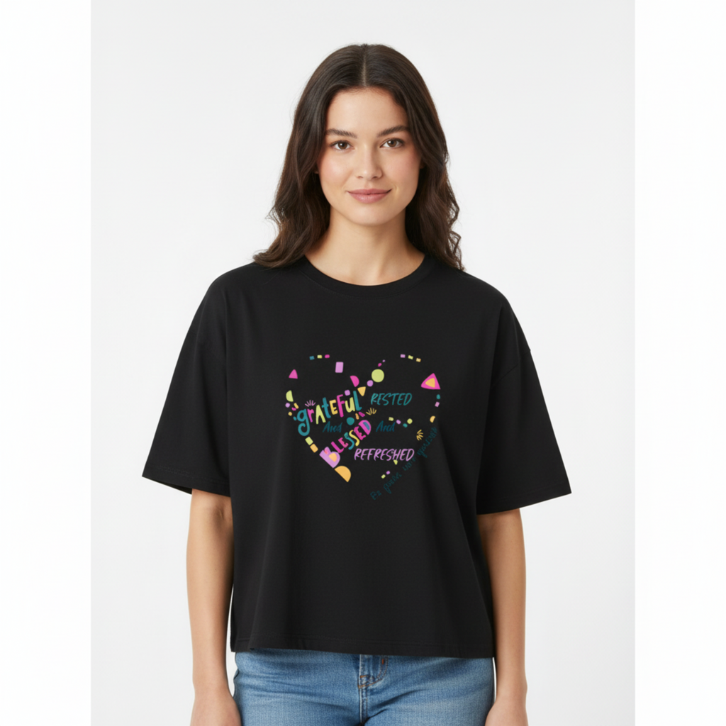 Woman wearing oversized grateful and blessed tee