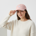 Woman wearing SHAREYOUR HEART cap